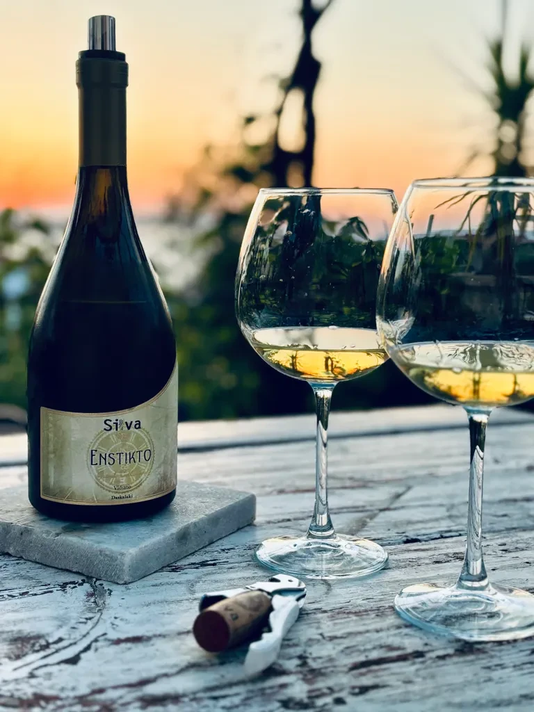 Wine bottle with glasses in background